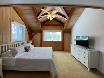 a bedroom with a bed and a ceiling fan at Peaceful & secluded, yet close to town. in Mariposa