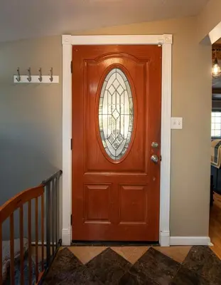 a wooden door with a stained glass window on it at Cedar Ridge Hot Tub BBQ Sleeps 8 in Oakhurst