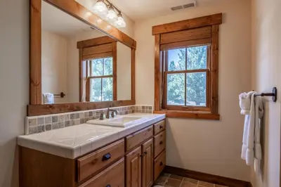 a bathroom with a sink and a mirror at Lodges 1112 - 3 Bed townhome with Loft in Mammoth Lakes