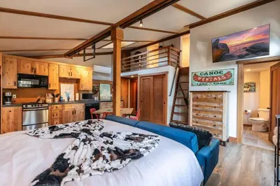 a bedroom with a large bed and a kitchen at Studio with Incredible Location in Tahoe City in Tahoe City
