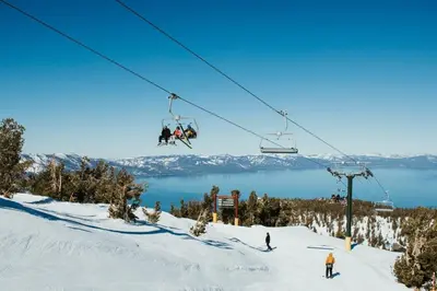 a group of people on a ski lift in the snow at Studio with Incredible Location in Tahoe City in Tahoe City
