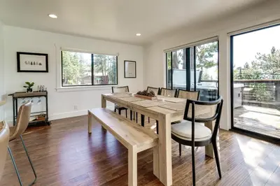 a dining room with a wooden table and chairs at Steps to Beach Family Home with Views in Tahoe City in Tahoe City