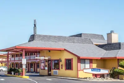 a building on the corner of a street at Travelodge by Wyndham Turlock in Turlock