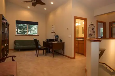 a living room with a desk and a couch at Big Luxury South Lake Tahoe Home in South Lake Tahoe