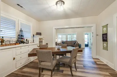 a kitchen and dining room with a table and chairs at Sunny Turlock Cottage Walk to Downtown! in Turlock