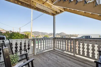 a balcony with a view of the ocean at Mtn-View Apt with Deck in Historic Virginia City in Virginia City