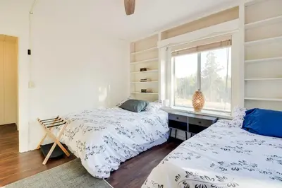 a bedroom with two beds and a window at Waterfront Mariposa Vacation Rental with Hot Tub in Mariposa