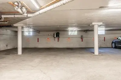 an empty parking garage with a car parked in it at Summit Forester #47 BLDG.2 Bedrm / 2 bath Ski in Ski Out! Steps to Chair 15 at Little Eagle Lodge! in Mammoth Lakes