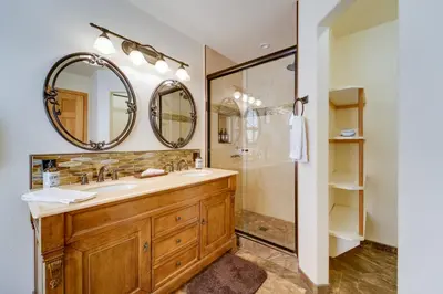a bathroom with a sink and a mirror at 4 Mi to Downhill Ski Resort! Spacious Family Haven in Truckee