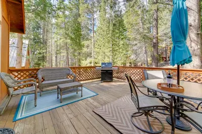 a deck with a table and chairs and a grill at 4 Mi to Downhill Ski Resort! Spacious Family Haven in Truckee