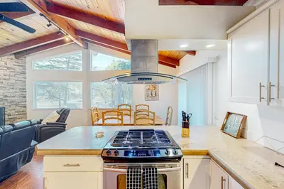 a kitchen with a stove top oven in a room at Red Umbrella Hideaway in Groveland