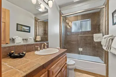 a bathroom with a sink and a toilet and a shower at Getting Away Together home in South Lake Tahoe