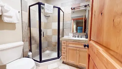 a bathroom with a shower and a toilet and a sink at Val D'Isere #8 condo in Mammoth Lakes