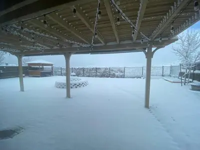 a covered patio with snow on the ground at Cozy hideaway 30 miles to Mt Rose Ski, Tahoe/ Reno in Reno