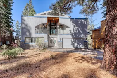 a rendering of a house with a tree at Remarkable Roundhouse Retreat in Truckee