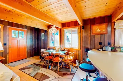 a dining room with a table and chairs at Tranquil Treehouse Haven in Tahoe City