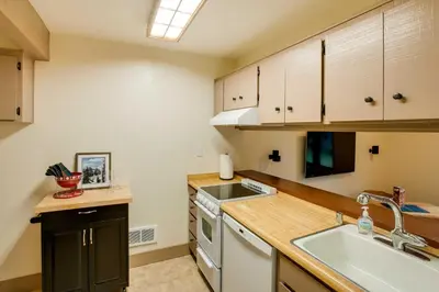 a kitchen with a sink and a dishwasher at Mountain Condo with Fireplace in Kirkwood Ski Resort in Kirkwood