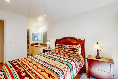 a bedroom with a bed and a sink in it at Sierra Park Villas 11 C in Mammoth Lakes