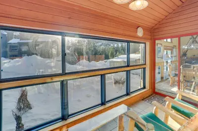 a screened in porch with a view of the snow at Mammoth Lakes Condo - Steps to Ski Lift! in Mammoth Lakes