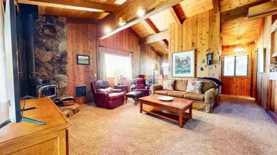 a living room with a couch and a table at Villa de los Pinos #40 condo in Mammoth Lakes