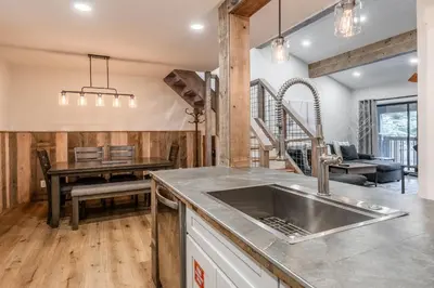 a kitchen with a sink and a dining room at New Listing 2 bedroom +Loft 2 bath Summit E Bldg. #8 condo sleeps 8, Steps to Eagle Lodge/Chair #15 in Mammoth Lakes