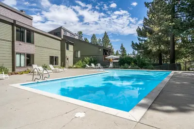a swimming pool in the backyard of a house at New Listing 2 bedroom +Loft 2 bath Summit E Bldg. #8 condo sleeps 8, Steps to Eagle Lodge/Chair #15 in Mammoth Lakes