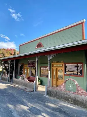 a green building with a store on the street at The Shopkeeper's Cottage ~ CHIC! in Amador City
