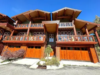 a large wooden house with balconies on it at Juniper Crest #2 townhouse in Mammoth Lakes