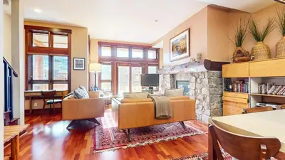 a living room with a couch and a fireplace at Juniper Crest #2 townhouse in Mammoth Lakes