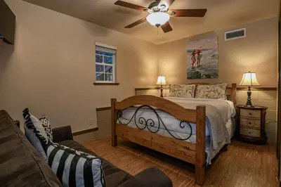 a bedroom with a bed and a ceiling fan at Classic 3BD Tahoe Cabin with Hot Tub in Carnelian Bay