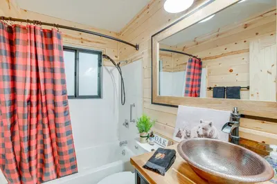 a bathroom with a sink and a mirror at Arnold Cabin Near Calaveras Big Trees State Park! in Arnold