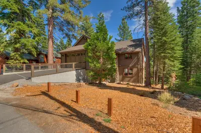 a house with a skate park in front of it at Bluebird Lodge by Tahoe Getaways - 4 BR with Hot Tub, Pool Table & Lake Views in Carnelian Bay