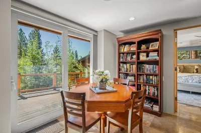 a dining room with a table and chairs and a large window at Mountain Zen Tahoe Luxury Property Incline Village Lakeview in Incline Village