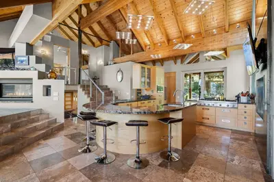 a kitchen with a large center island with bar stools at Mountain Zen Tahoe Luxury Property Incline Village Lakeview in Incline Village
