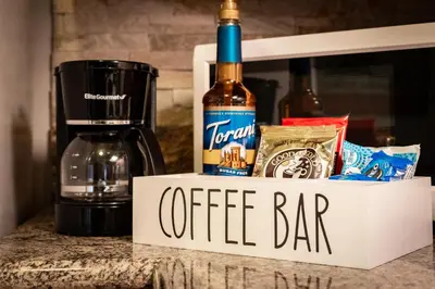 a complimentary coffee bar with a bottle of wine at Alpine Alcove: Tahoe Tranquility Near Kings Beach in Tahoe Vista