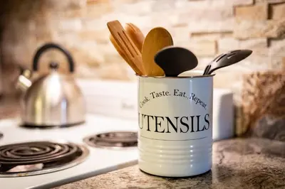 a can of utensils sitting on top of a stove at Alpine Alcove: Tahoe Tranquility Near Kings Beach in Tahoe Vista