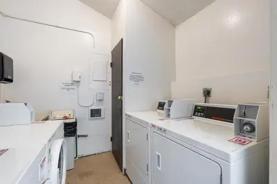 a kitchen with white appliances in a room at Alpine Alcove: Tahoe Tranquility Near Kings Beach in Tahoe Vista