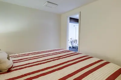 a bedroom with a bed with a striped blanket at Spacious Reno Vacation Rental about 3 Mi to MidTown! in Reno