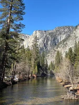 a river with trees and mountains in the background at Wonky Donkey Den 30 mi to Yosemite Arch Entrance in Mariposa