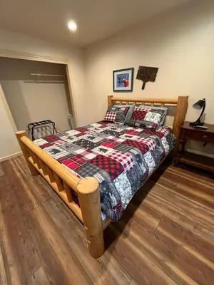 a bedroom with a bed with a quilt on it at Wonky Donkey Den 30 mi to Yosemite Arch Entrance in Mariposa