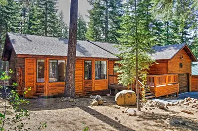 a wooden cabin in the middle of a forest at Truckee Northstar Family Home by Jaeger Retreat in Truckee