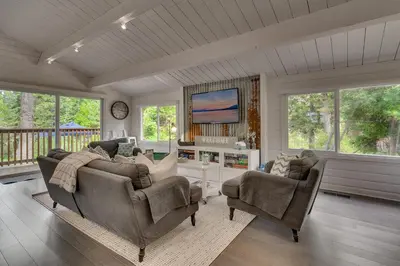 a living room with a couch and two chairs at Blackwood Bungalow on the West Shore by Tahoe Getaways - 3 BR Pet Friendly & Walking Distance to the Lake in Homewood