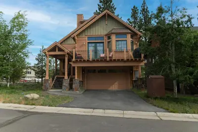 a house with a balcony and a garage at Coyote Run Retreat by Tahoe Getaways - 3BR Pet Friendly with HOA Amenities, Minutes to Downtown Truckee & Northstar Resort! in Truckee