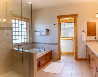 a bathroom with a tub and a shower at Coyote Run Retreat by Tahoe Getaways - 3BR Pet Friendly with HOA Amenities, Minutes to Downtown Truckee & Northstar Resort! in Truckee