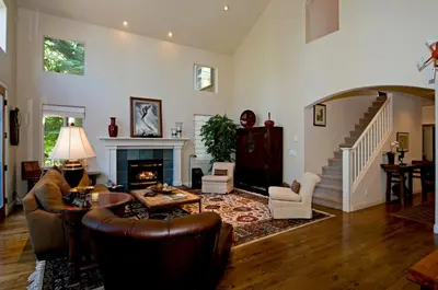 a living room filled with furniture and a fireplace at Big Springs by Tahoe Getaways - 6BR w Ski Shuttle, Fireplace & Entertainment Room in Truckee