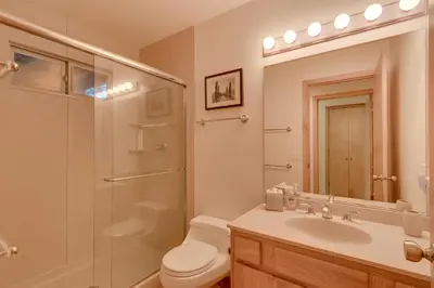 a bathroom with a shower and a toilet and a sink at Deer Hollow by Tahoe Getaways at Northstar - 4BR w Hot Tub, Ski Shuttle, & HOA Amenities in Truckee