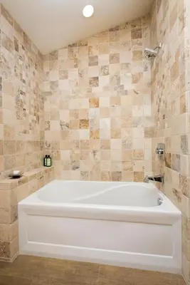 a large white tub in a bathroom with tiles at Caleb's Getaway by Tahoe Getaways at Old Greenwood- 3BR w Bonus Room, Pets Welcome & Ski Shuttle! in Truckee