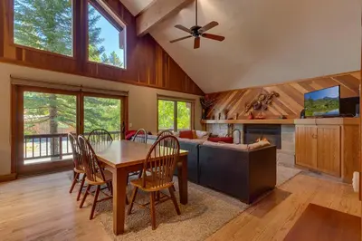 a dining room with a table and a couch at Club 151 at Dollar Point by Tahoe Getaways - Pet-Friendly 4BR w Hot Tub & Fenced Yard in Tahoe City