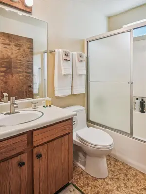 a bathroom with a toilet and a sink and a shower at Rustic Retreat by Tahoe Getaways - 4BR Tahoe Donner Contemporary Cabin w Forest Views, Pet-Friendly & HOA Amenities in Truckee