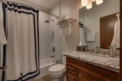 a bathroom with a toilet and a sink and a shower at Truckee Luxe by Tahoe Getaways - 3 BR Luxury Gray's Crossing Townhome w Hot Tub on Golf Course - Close to Downtown & Northstar in Truckee